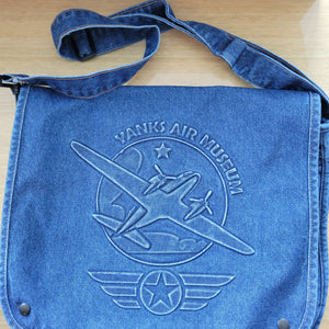 A blue denim embossed canvas messenger bag with the 'YANKS AIR MUSEUM' printed on the front.