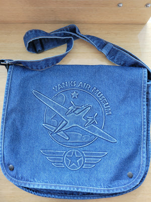 A blue denim embossed canvas messenger bag with the 'YANKS AIR MUSEUM' printed on the front.