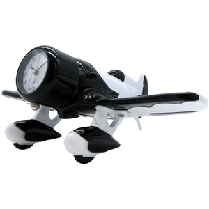 A desk clock designed to resemble a black and white Gee Bee racing airplane with wings and propellers.