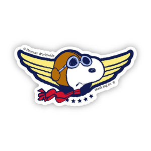 Sticker of a Snoopy cartoon character with wings and a red scarf featuring 'Peanuts Worldwide'.