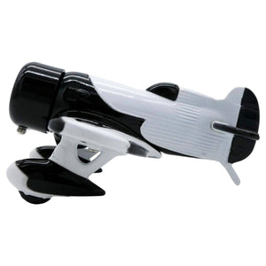 A desk clock designed to resemble a black and white Gee Bee racing airplane with wings and propellers.