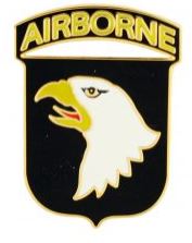A shield-shaped pin featuring an eagle and the text 'AIRBORNE'.