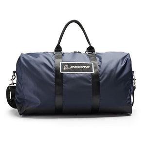A navy-colored Boeing duffle bag with a logo on the front, featuring adjustable shoulder straps and webbing details.