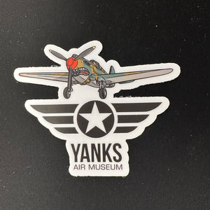 Sticker of a vintage P-40 Warhawk airplane with a star and 'Yanks Air Museum' logo black background