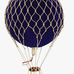 Navy blue hot air balloon with a wicker basket on a white background