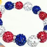 Bracelet with red, white, and blue beads on a white background