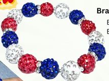 Bracelet with red, white, and blue beads on a white background