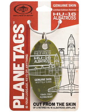 A collectible Moto Art airplane tag with a Grumman HU-18 Albatross design, featuring text and illustrations related to the history of the aircraft.