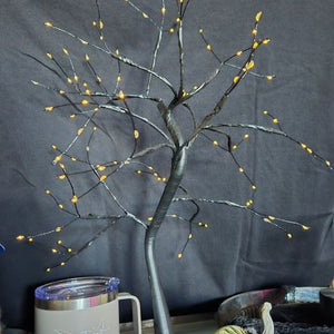 Decorative tree with lights on a dark background