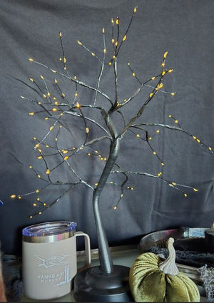 Decorative tree with lights on a dark background