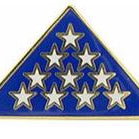 A memorial pin with a blue background featuring gold stars in a triangular pattern.