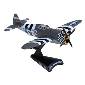 A 1:100 scale model of a P-51 Thunderbolt airplane, displayed on a black stand. The model features a dark gray and black striped fuselage, white star insignias, a black-and-white checkered engine cowling, and yellow accents on the propeller blades.