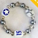 Bracelet with various charms including a star and plane 