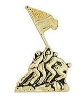 A metal pin with a design depicting a flag being raised, possibly representing Iwo Jima 