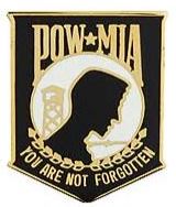 A pin with a gold and black color scheme featuring the silhouette with the text 'POW-MIA YOU ARE NOT FORGOTTEN'.