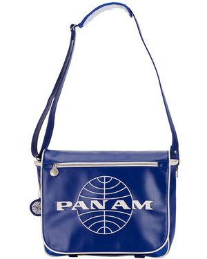 A blue messenger bag with an embossed Pan Am logo and a brushed nickel hardware detail.