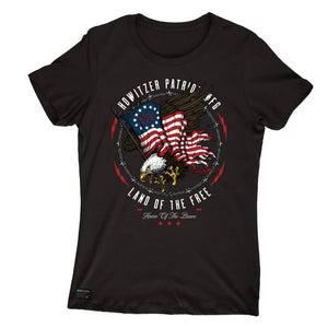 A black short-sleeve crewneck t-shirt featuring a circular graphic on the chest with an eagle, American flag, and the text 'HOWitzer PATRIOT AGE LAND OF THE FREE'.