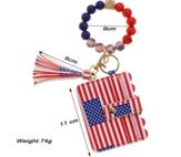 Wristlet with American flag keychain, coin purse and tassel on a white background