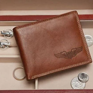 Brown leather wallet with embossed wing design
