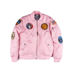 Pink bomber jacket with patches on a white background
