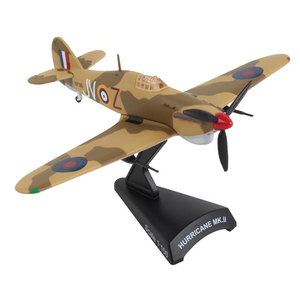 A scale model of a Hurricane Mk. II military aircraft on a black display stand, featuring a tan and brown camouflage pattern with roundel insignias.