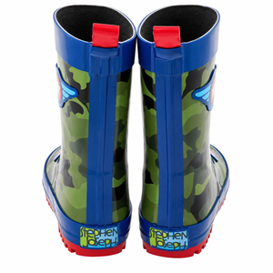 A pair of children's rain boots shown from the back, featuring a green and black camouflage pattern with bright blue sides and red pull tabs and soles. The name 'Stephen Joseph' is printed on the back of the soles.