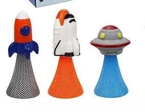Three colorful toy figures resembling a rocket, astronaut, and UFO on a white background.