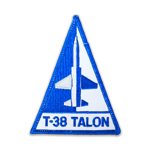 Embroidered patch with a blue border and white center featuring an airplane and 'T-38 Talon' text on a white background.