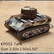 Small die cut wood tank with camouflage design on a textured surface