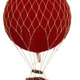 Red hot air balloon with a wicker basket on a white background