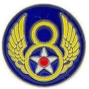 A round metal 8th Air Force pin with blue, gold, and red colors featuring winged star and circle design.