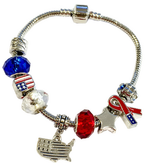 Bracelet with American flag and ribbon charms on a white background