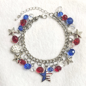 Bracelet with star and American flag charm on a white background