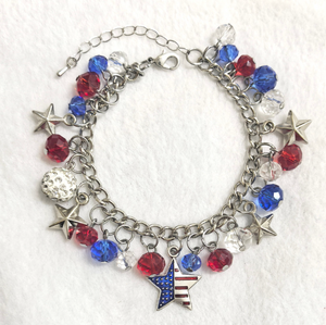 Bracelet with star and American flag charm on a white background