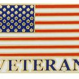 A pin badge featuring the United States flag and the word 'VETERAN' on a striped background.