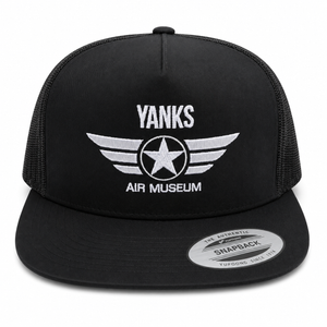 A black trucker-style snapback cap with white embroidered text reading 'YANKS AIR MUSEUM' and a winged star logo on the front, shown against a plain white background. A circular 'Authentic Snapback' sticker is visible on the brim.