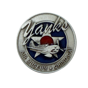 Circular badge with airplane design and 'Yanks Air Museum Chino, CA' text on a white background