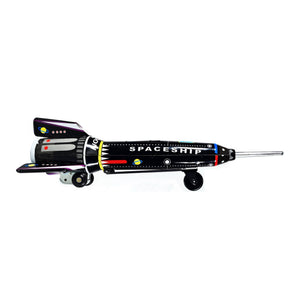 A black toy rocket with red and white accents, named 'Radon', with a friction drive mechanism.