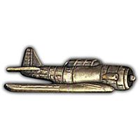 A pin shaped like an AT-6 Texan airplane, predominantly in silver color.