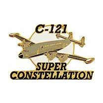 A gold-colored pin shaped like an airplane with the text 'C-121 SUPER CONSTELLATION' on it.