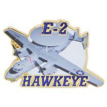 A pin badge with the E-2 Hawkeye aircraft depicted on it, with a predominantly silver color and blue accents.