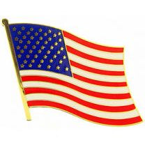 A pin shaped like the flag of the United States, featuring red and white stripes with a blue field and white stars.