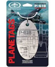 A collectible metal plane tag with a graphic of the Northrop P-61 Black Widow aircraft, featuring red and black colors and detailed illustration, packaged on a card with the Moto Art logo and 'PLANE TAGS' and 'P-61B BLACK WIDOW'.