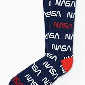 A pair of socks with NASA's 'Worm' logo woven into a navy background with red tips.
