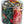 A clear plastic bucket containing a variety of plastic military figures in different uniforms.