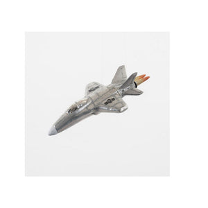A glass airplane airplane jet Christmas ornament against a white background.