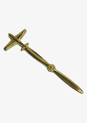A gold-plated, sculptured airplane-shaped letter opener.