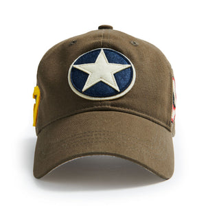 A brown baseball cap with a roundel patch featuring a star and a shark mouth embroidery on the front.
