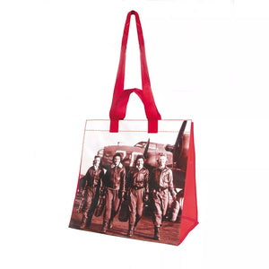 A red tote bag featuring a black and white photograph of the Women Airforce Service Pilots from 1944, with an additional red handle on the side.
